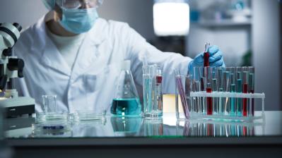 Lab,Worker,Putting,Medical,Blood,Sample,In,Place,After,Examining
